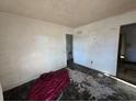 Vacant bedroom features worn walls, flooring, and natural light at 3720 12Th S Ave, St Petersburg, FL 33711