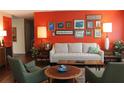 Stylish living room with modern furniture, bright accents, and hardwood floors at 406 2Nd Sw St, Ruskin, FL 33570