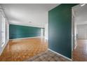 Spacious living room featuring hardwood floors and neutral paint at 4435 Sail Dr, New Port Richey, FL 34652
