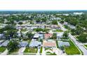 Neighborhood aerial shot showing a well-situated home with a private pool amidst lush greenery at 5672 62Nd N Way, St Petersburg, FL 33709