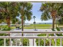 Balcony with partial ocean view, offering a relaxing space to enjoy the scenery and the proximity to playground at 611 Destiny Dr # 204, Ruskin, FL 33570
