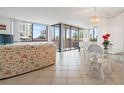 Bright living area with large windows and access to balcony, seamlessly connected to dining space for easy living at 6269 Palma Del Mar S Blvd # 306, St Petersburg, FL 33715