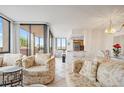 Open-concept living area with seamless flow to dining and kitchen, creating a welcoming and spacious environment at 6269 Palma Del Mar S Blvd # 306, St Petersburg, FL 33715