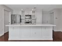 Bright kitchen with white cabinetry, stainless steel appliances, and marble countertops at 700 S Harbour Island Blvd # 731, Tampa, FL 33602
