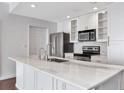 Bright kitchen with white cabinetry, stainless steel appliances, and marble countertops at 700 S Harbour Island Blvd # 731, Tampa, FL 33602
