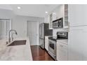 Bright kitchen with white cabinetry, stainless steel appliances, and marble countertops at 700 S Harbour Island Blvd # 731, Tampa, FL 33602