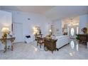 Bright living room featuring tile floors, neutral walls, and ample seating with a seamless flow at 1210 Wolford Dr, Trinity, FL 34655