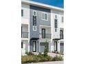 Modern townhomes with unique numbers, balconies and well-maintained lawns at 1529 N Morgan St, Tampa, FL 33602
