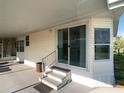 Covered outdoor patio area, ideal for entertaining and enjoying the pleasant neighborhood surroundings at 1710 7Th Sw St # 85, Ruskin, FL 33570