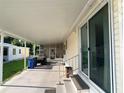Extended covered carport and patio area, perfect for outdoor living, providing ample space for parking and relaxing at 1710 7Th Sw St # 85, Ruskin, FL 33570
