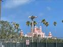 Iconic pink hotel view from the nearby baseball field, situated in a sunny outdoor setting at 3207 S De Bazan Ave, St Pete Beach, FL 33706