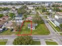 Overhead view showcasing a property with a well-maintained lawn, and tree coverage in a quiet neighborhood at 4001 W Carmen St # 1/2, Tampa, FL 33609