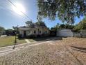 Charming single-story home featuring a detached garage and a long driveway at 403 E Carolina Ave, Plant City, FL 33563