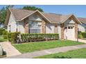 Charming home with a manicured lawn, mature shrubs, and an inviting front facade showcasing its curb appeal at 4655 Wallingford Ct # 4655, New Port Richey, FL 34655