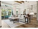 Spacious living room with abundant natural light, stylish furnishings, wood beams, and an open layout at 5314 Alafia Falls Dr, Lithia, FL 33547