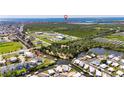 Aerial view of a neighborhood situated along canals and with access to the open bay at 6522 Simone Shores Cir, Apollo Beach, FL 33572