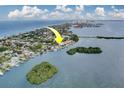 An aerial view showcases the home's prime waterfront location at 803 Harbor Dr, Belleair Beach, FL 33786