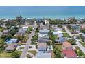 Breathtaking aerial view showcasing the home's prime location near the tranquil beach and stunning ocean views at 101 8Th St, Belleair Beach, FL 33786