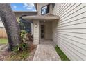 Welcoming front porch features neutral tones, updated brickwork, and beautifully manicured greenery at 1139 43Rd N Ave, St Petersburg, FL 33703