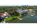 Waterfront home with a private dock and lush landscaping overlooking the bay at 1238 Monterey Ne Blvd, St Petersburg, FL 33704