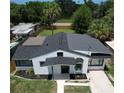 An aerial view reveals this home's new roof, landscaping and freshly sealed driveway at 1762 Fulton Ave, Clearwater, FL 33755