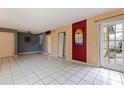 Bright living room featuring tile floor and back door entrance at 1799 N Highland Ave # 3, Clearwater, FL 33755