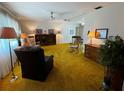 Spacious living room features classic furnishings, warm lighting, and inviting atmosphere at 2195 Academy Dr, Clearwater, FL 33764