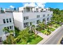 Beautiful modern townhomes feature lush landscaping, private balconies, and rooftop terraces at 2442 W Mississippi Ave # 5, Tampa, FL 33629