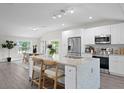 Modern kitchen with stainless steel appliances, granite countertops, and an island with seating at 4121 W San Nicholas St, Tampa, FL 33629