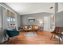 Bright living room with hardwood floors, comfortable seating, and stylish accents at 4150 Pecos Dr, New Port Richey, FL 34653