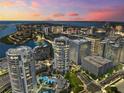 Stunning aerial view of high-rise condo buildings with city skyline and bay views at sunset at 449 S 12Th St # 1201, Tampa, FL 33602