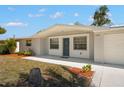 Close up of a charming single-story home and freshly painted exterior at 5122 Chet Dr, New Port Richey, FL 34652