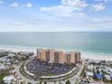 Panoramic aerial showcasing the beachfront condo, coastline and lush surroundings of the neighborhood at 880 Mandalay Ave # N607, Clearwater Beach, FL 33767