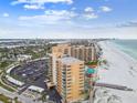 Amazing aerial view of the condo complex with a pool, private beach access and Gulf views at 880 Mandalay Ave # N607, Clearwater Beach, FL 33767
