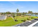 View of the community grounds, pool, and waterway at 10216 Regal Dr # 409, Largo, FL 33774