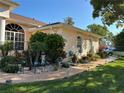 View of landscaped yard with garden lights at 13339 Amberwood St, Hudson, FL 34669