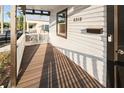Inviting front porch with wood flooring and a white picket fence offers curb appeal at 2315 E 12Th Ave, Tampa, FL 33605