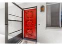 Stylish front door boasts a decorative carved design and sidelight at 2630 Pearce Dr # 108, Clearwater, FL 33764