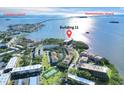 Stunning aerial view of Building 11 nestled between Caladesi Island and Honeymoon Island at 2700 Bayshore Blvd # 11308, Dunedin, FL 34698