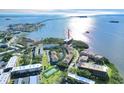 Beautiful aerial view of a building next to the water, showcasing lovely landscaping and waterfront views at 2700 Bayshore Blvd # 11308, Dunedin, FL 34698