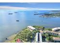 An impressive aerial view of a waterfront community with lush trees and stunning water views at 2700 Bayshore Blvd # 11308, Dunedin, FL 34698