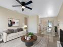 Inviting living room with neutral decor and modern furnishings next to adjacent dining room at 4925 Murray Hill Dr, Tampa, FL 33615