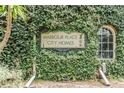 Attractive Harbour Place City Homes sign surrounded by mature landscaping at 501 Knights Run Ave # 6104, Tampa, FL 33602