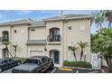 Inviting townhome with a private balcony and stylish architecture in a desirable neighborhood with assigned parking at 501 Knights Run Ave # 6104, Tampa, FL 33602