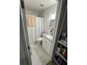 Bathroom featuring modern fixtures, granite vanity, updated flooring, and a tiled shower at 601 N Hercules Ave # 1008, Clearwater, FL 33765