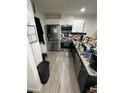 Modern kitchen features stainless steel appliances, granite countertops, and ample cabinet space at 601 N Hercules Ave # 1008, Clearwater, FL 33765