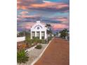 Charming view of the Little Harbor entrance with lovely landscaping and well-maintained brick road at 611 Destiny Dr # 509, Ruskin, FL 33570