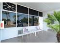 Inviting patio area with chairs and a table, perfect for relaxing outdoors with beautiful ocean view at 611 Destiny Dr # 509, Ruskin, FL 33570