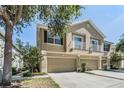 Inviting two-story townhouse with a two-car garage and dual balconies at 6736 Breezy Palm Dr, Riverview, FL 33578