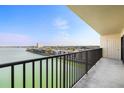 Relax on the balcony with views of the water, sky, and building at 7300 Sun Island S Dr # 605, South Pasadena, FL 33707